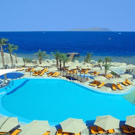Xperience Sea Breeze Resort (Adults Only) Sharm el Sheikh Esterno foto A swimming pool at a resort in Egypt