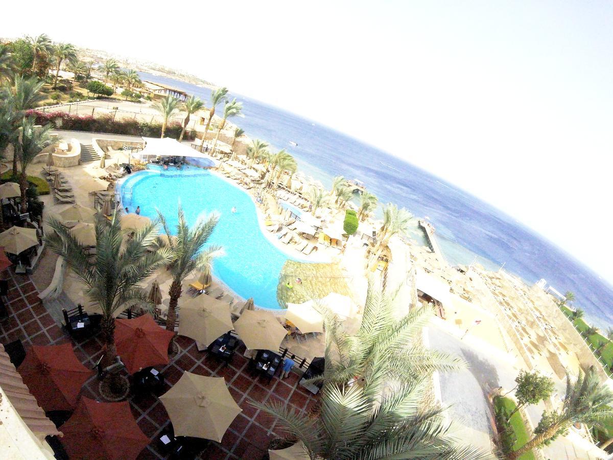 Xperience Sea Breeze Resort (Adults Only) Sharm el Sheikh Esterno foto View of the pool at the Hilton Sharm El Sheikh